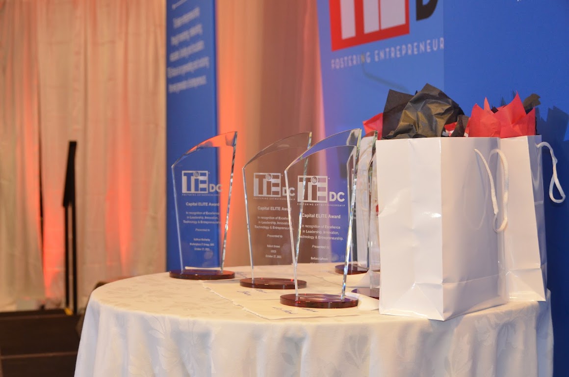 Trophies displayed on a table at TieDC GovCon Capital Elite Awards ceremony.